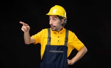 front view male builder uniform black wall