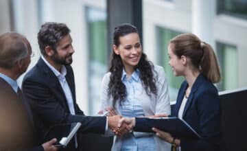 businesspeople having discussion office