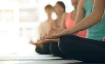 young women yoga indoors keep calm meditates while practicing yoga explore inner peace yoga meditation have good benefits health photo concept yoga sport healthy lifestyle