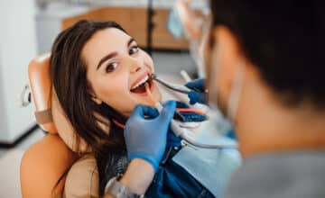 young female patient visiting dentist office