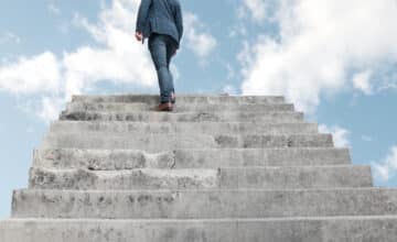 man climbing stairs heaven