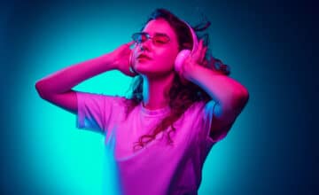 caucasian woman s portrait isolated blue background multicolored neon light