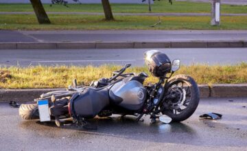 Wrecked motorcycle lying on the road
